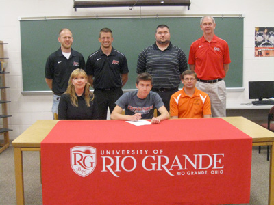 Meadowbrook High's Dallas Guy is joined by family and coaches as he signs to run at Rio Grande